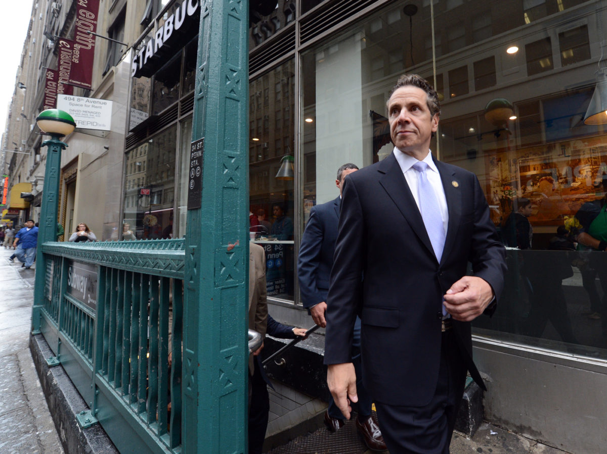 New York Governor Andrew M. Cuomo exiting a Subway station