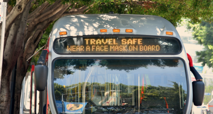 Rollsign on LA Metro bus reminds riders to wear a mask.